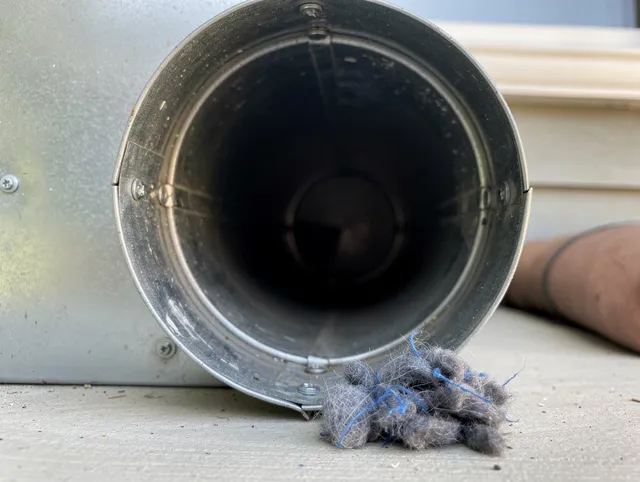 South Whittier Dryer Vent Cleaning technician using specialized equipment to clear severe dryer vent blockage in South Whittier